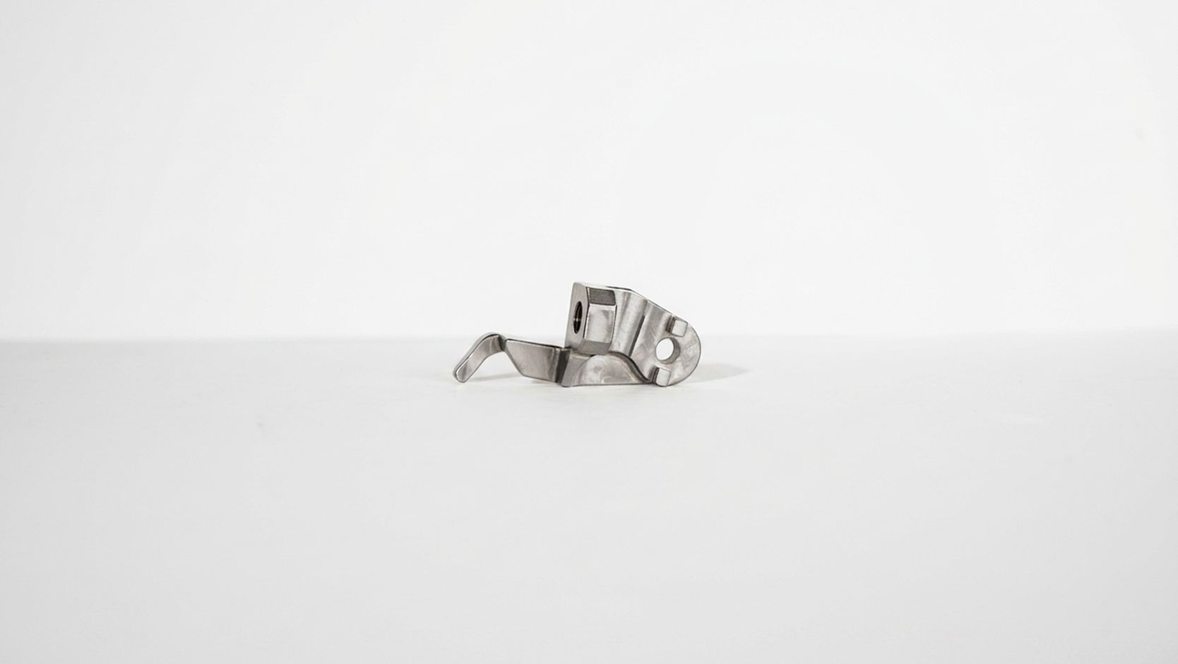 Precision machined component on a studio background